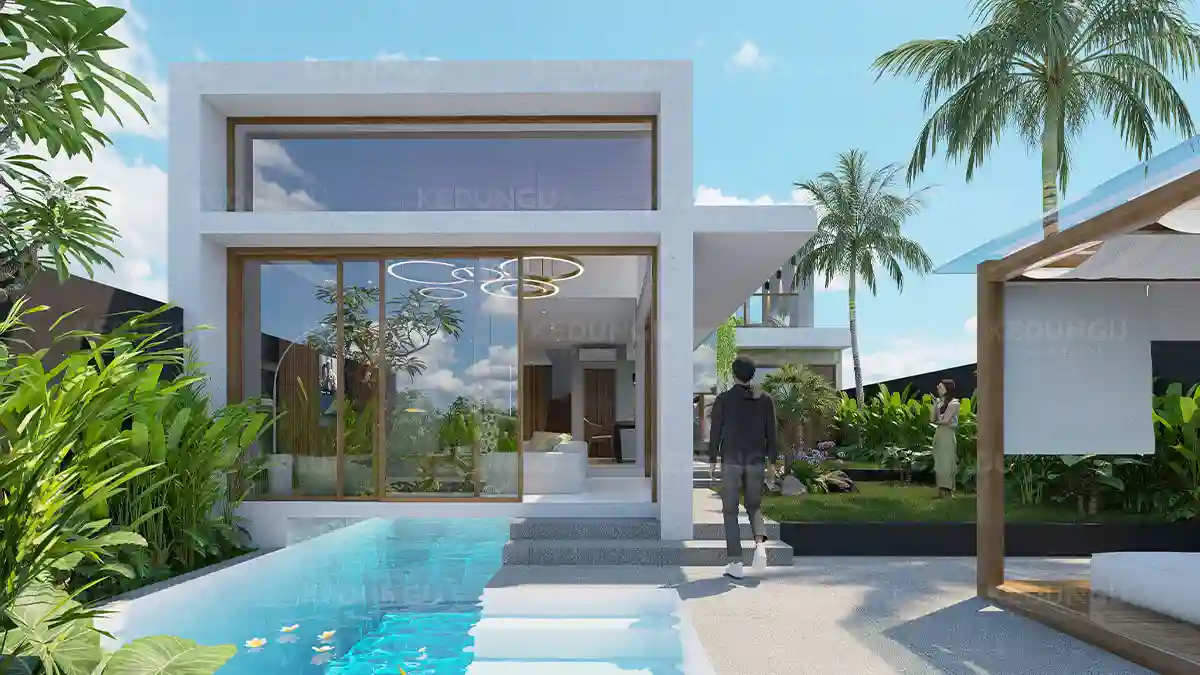 Front view of Kedungu Ocean 2BR villa showcasing pool, garden, and double-height architecture